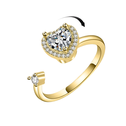 Gold ring with a heart-shaped diamond on a white background perfect for ADHD